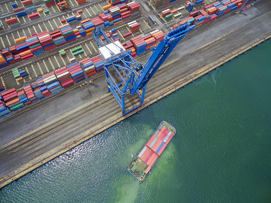 container cargo Ship parked Harbor cranes . Photograph by Anucha Sirivisansuwan