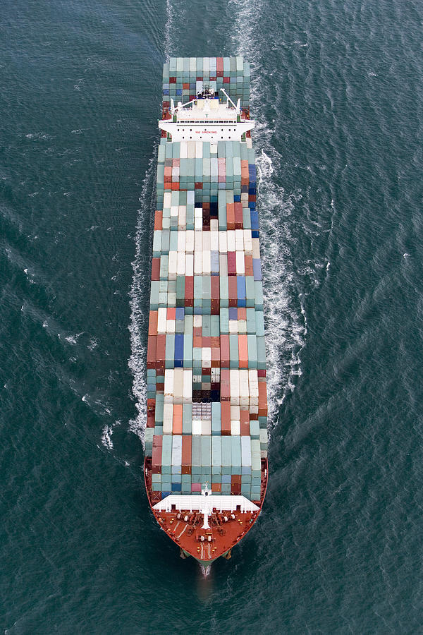 Container ship at sea, aerial view Photograph by James Lauritz