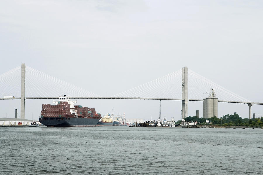 Container ship in a river with a suspension bridge in the background, Talmadge Bridge, Savannah River, Savannah, Georgia, USA Photograph by Glowimages