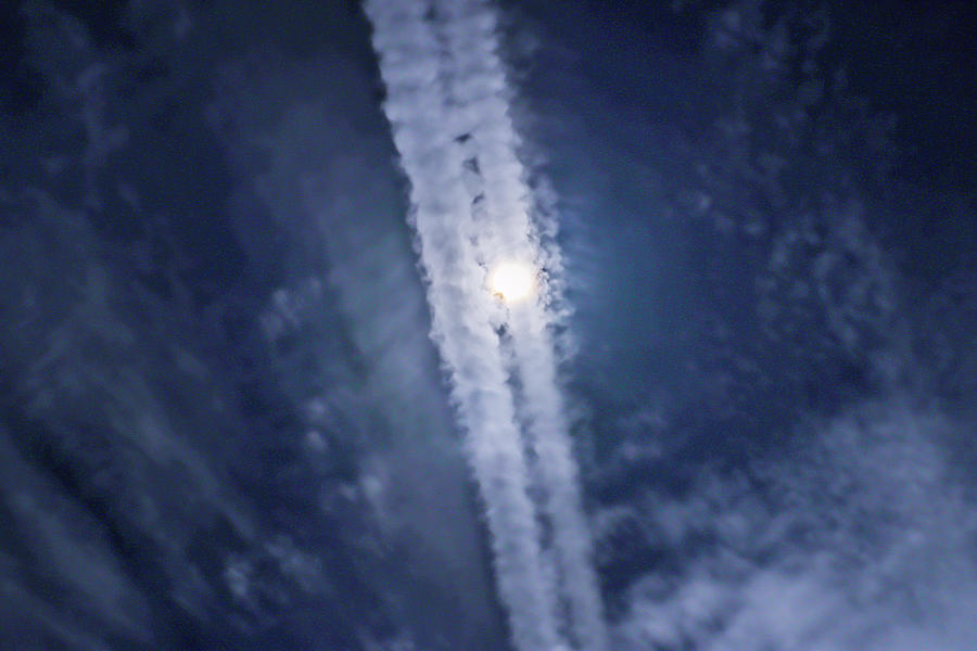 Contrail Sun Conflict Photograph by Ed Williams