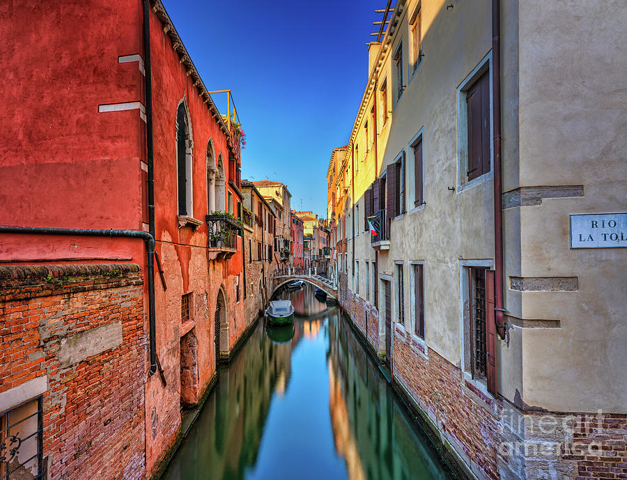 Contrasting symmetry in a Venetian canal Photograph by The P