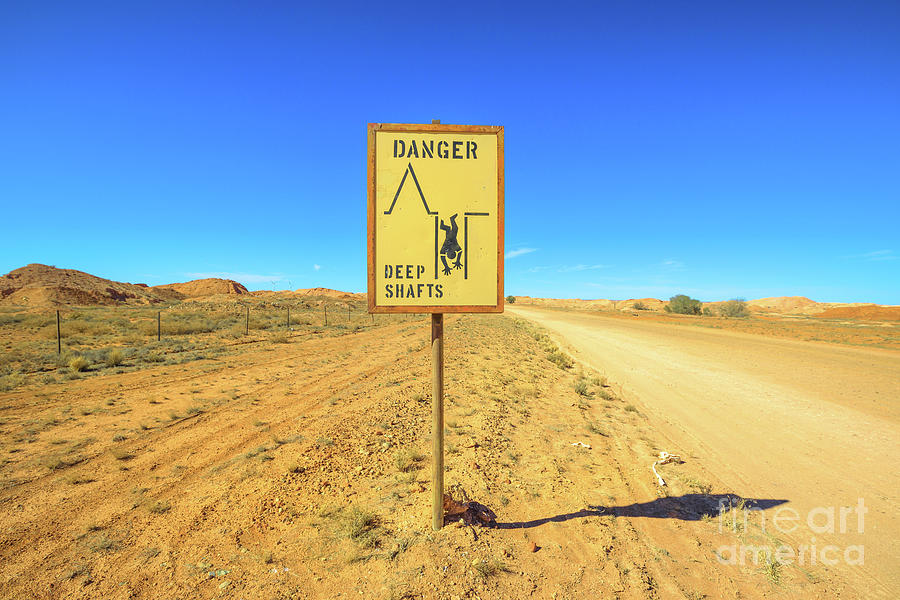 Coober Pedy danger cave road sign Photograph by Benny Marty