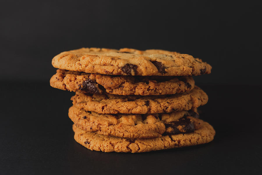 Cookies stacked with a black background Photograph by Scott Lyons