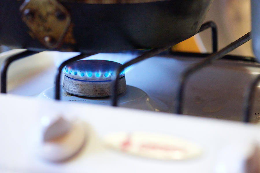 Cooking on gas stove Photograph by CliqueImages
