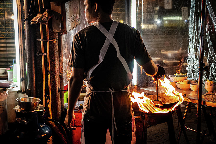 Cooking with a wok at Bangkoks Chinatown Photograph by Ruben Vicente