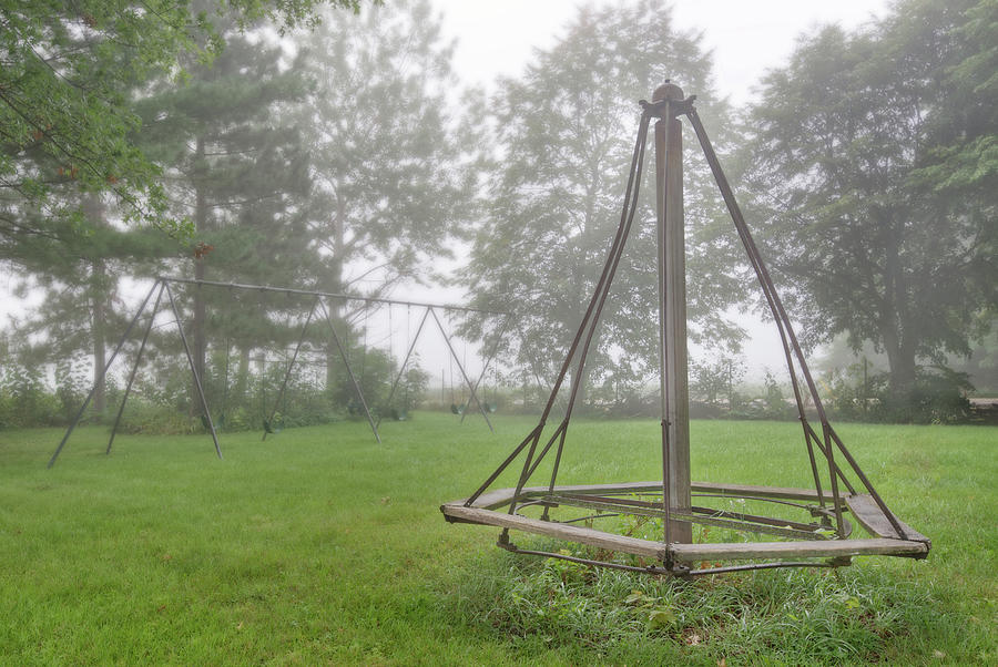 Playground Memories - swings and witches-hat merry go round at Cooksville WI schoolhouse in fog Photograph by Peter Herman