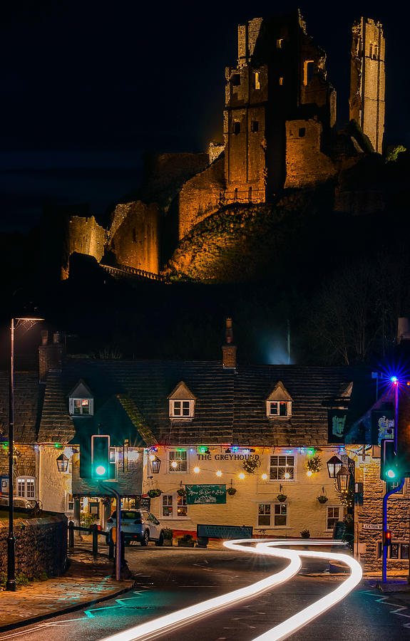 Corfe Castle In England Seen With A Car Passing By. Photograph