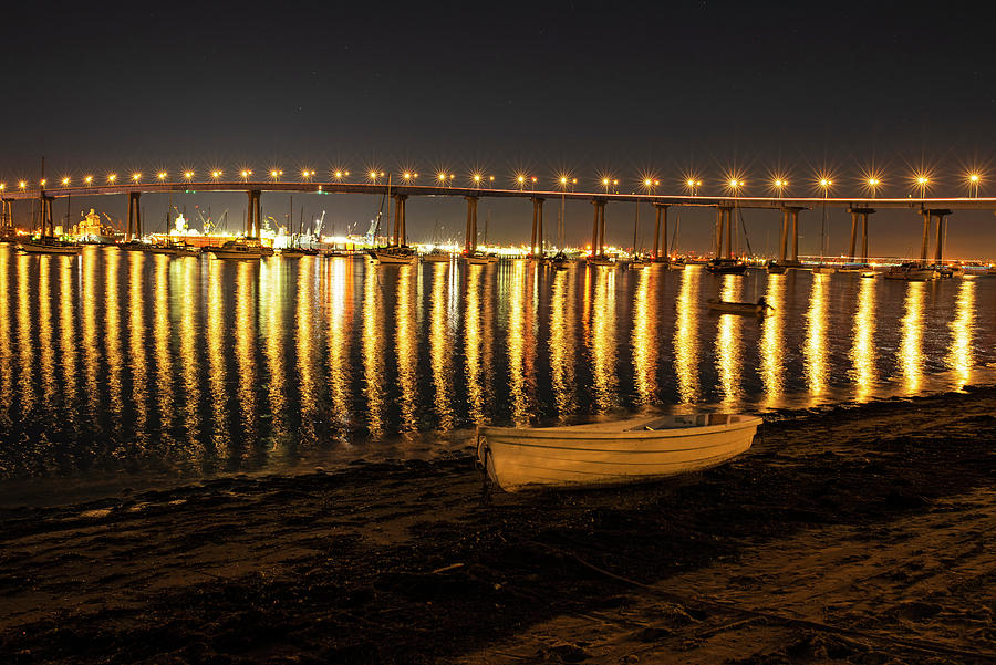 Coronado Rowboat at Night and the Coronado Bridge Coronado California Photograph by Toby McGuire