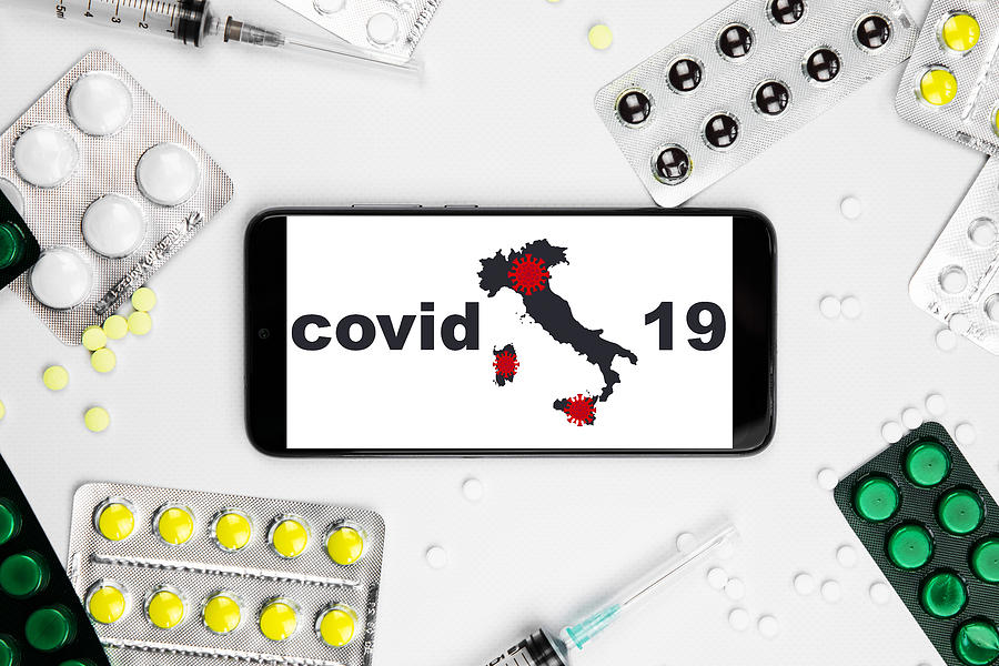 Coronavirus 2019-nCoV, COVID-19 in Italy. Smartphone with map of Italy with pills and vaccine. Photograph by Anton Petrus