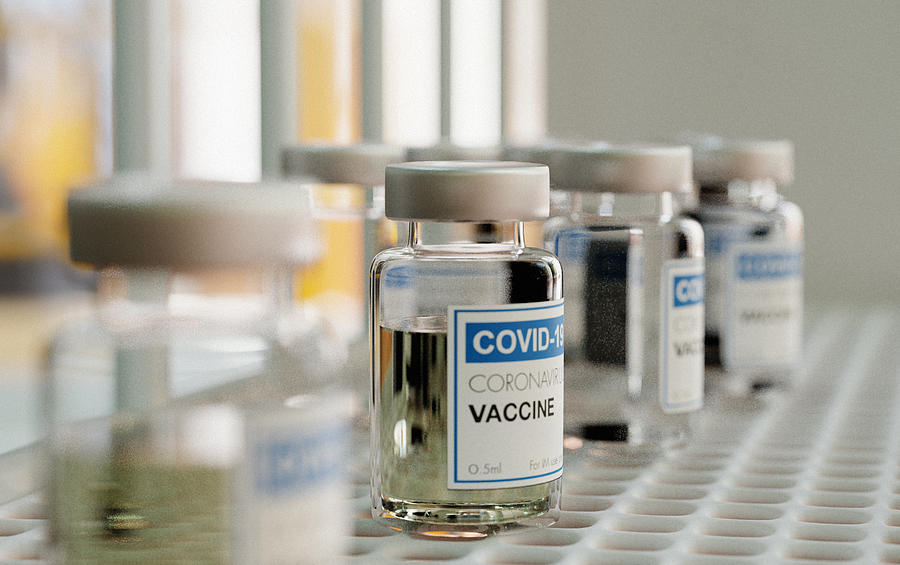 Coronavirus vaccine vials on a laboratory shelf Photograph by Joao Paulo Burini