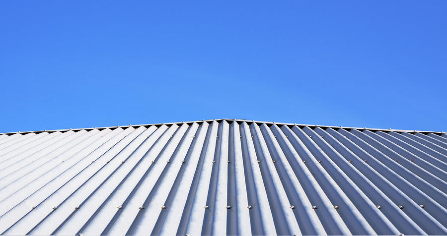 Corrugated Metal Roof and Blue Sky Photograph by KathyDewar