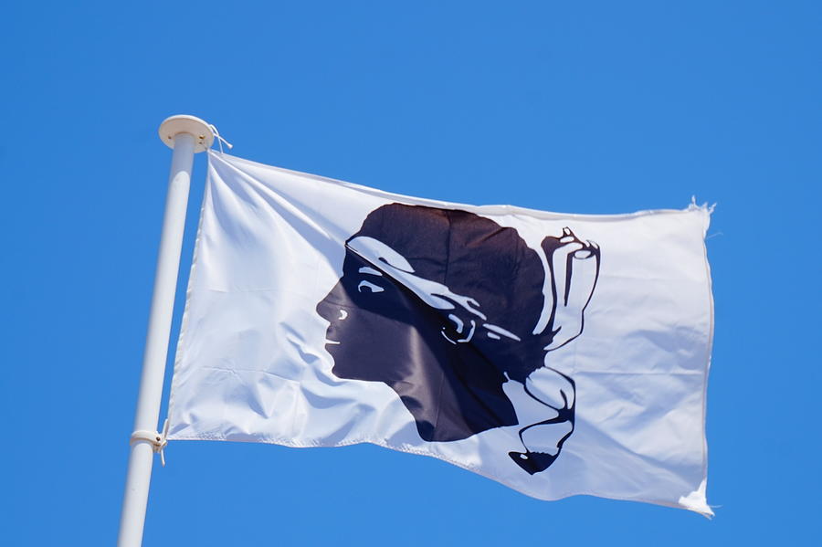 Corsican Flag in the Wind, Macinaggio, France Photograph by Sebastiaan Kroes