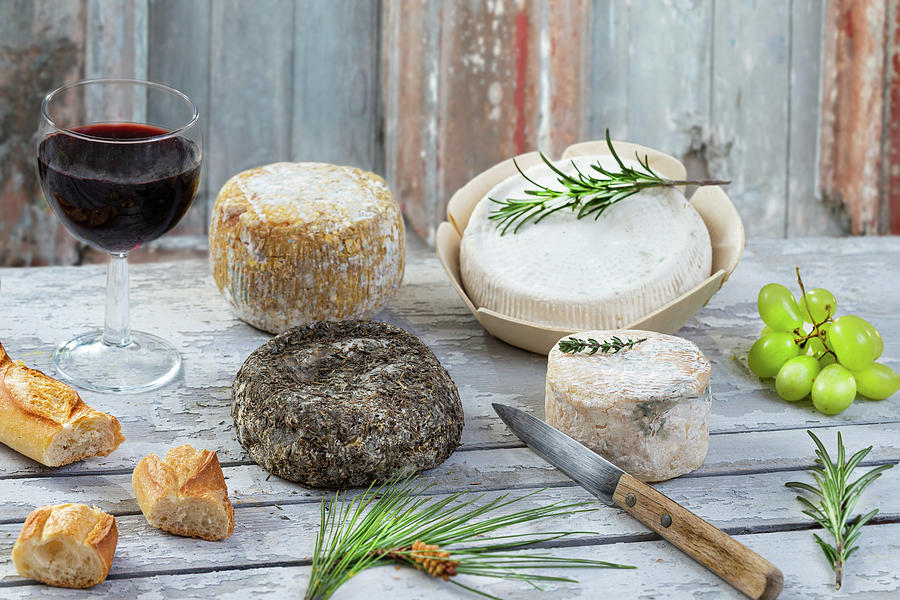 Corsican traditional varity of goat and sheep cheese and glass of red