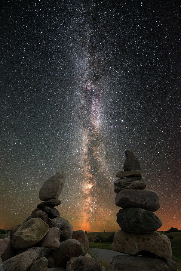 Cosmic Cairns -  Ultrawide shot of summer Milky Way over ND coulee pasture and cairns Photograph by Peter Herman