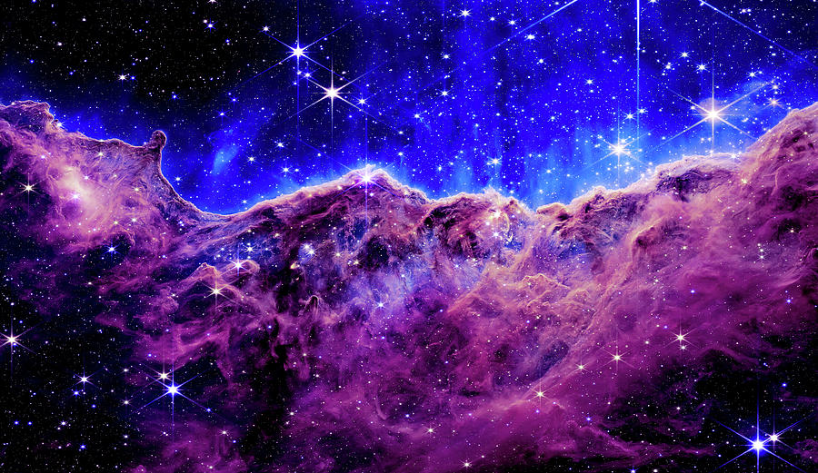 Cosmic Cliffs in the Carina Nebula - Pink and Blue Photograph by Eric Glaser