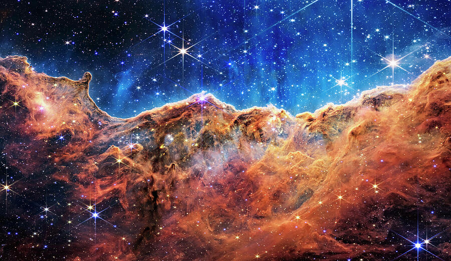 Interstellar Photograph - Cosmic Cliffs of The Carina Nebula From NASA ESA James Webb Space Telescope by Carol Japp