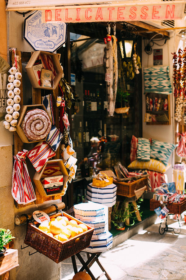 Cosy traditional gourmet shop selling food and handmade art in Palma de Mallorca Photograph by Carolin Voelker