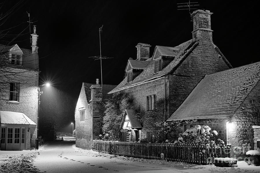 Cotswold Cottage in the Snow at Night in Bourton in the Water Monochrome Photograph by Tim Gainey
