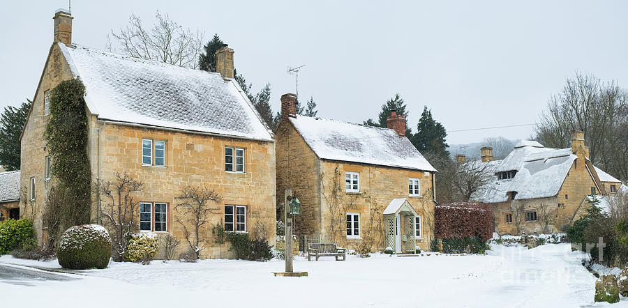 Cotswold Stone Cottages in the Winter Snow in Stanton Photograph by Tim Gainey