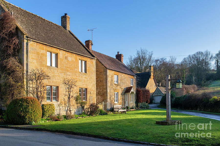 Cotswold Stone Cottages in Winter Sunlight at Sunset Photograph by Tim Gainey