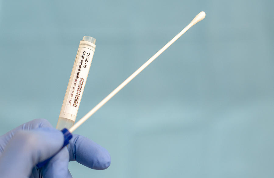 Cotton swab and test tube for Coronavirus test (COVID-19)), macro image of medical equipment in hands of healthcare professional Photograph by Paul Biris