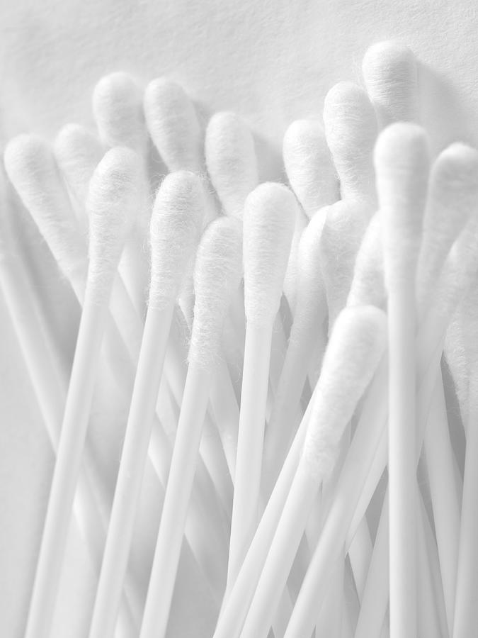 Cotton swabs on white textured background Photograph by Susan Trigg
