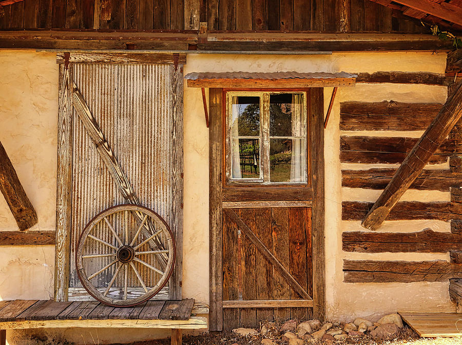 Cottage Photograph - Country Cabin and Antique Wheel by Judy Vincent