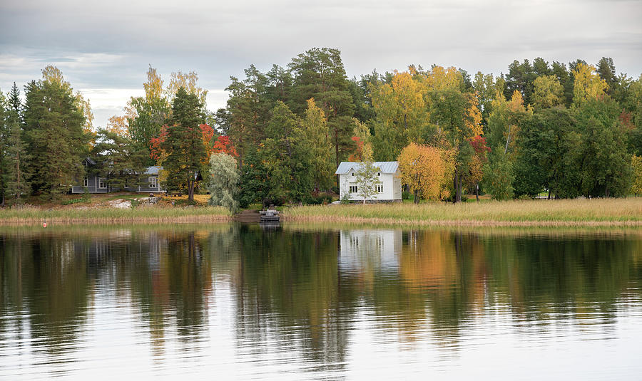 Country house in the forest in the lake. Autumn season Kuopio Finland Photograph by Michalakis Ppalis