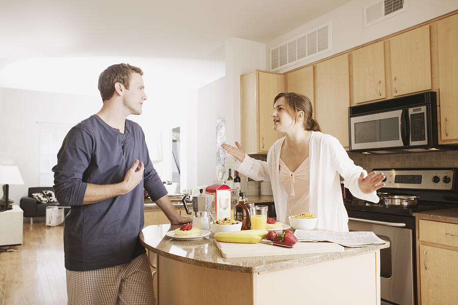 Couple arguing in kitchen Photograph by Jupiterimages, Brand X Pictures