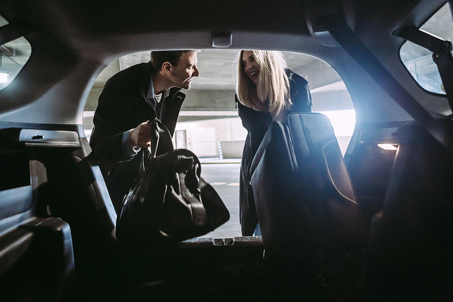 Couple at Airport Parking Garage Photograph by RyanJLane