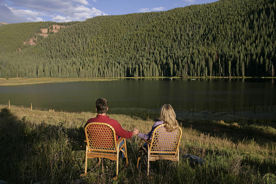 Couple by lake Photograph by Comstock Images