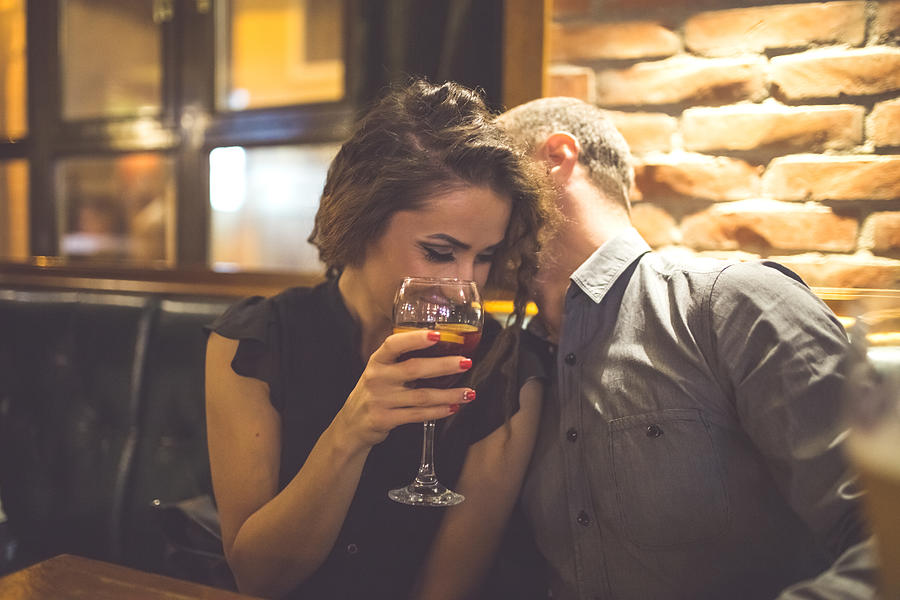 Couple Enjoying Night Out At Cocktail Bar Photograph by Milan_Jovic