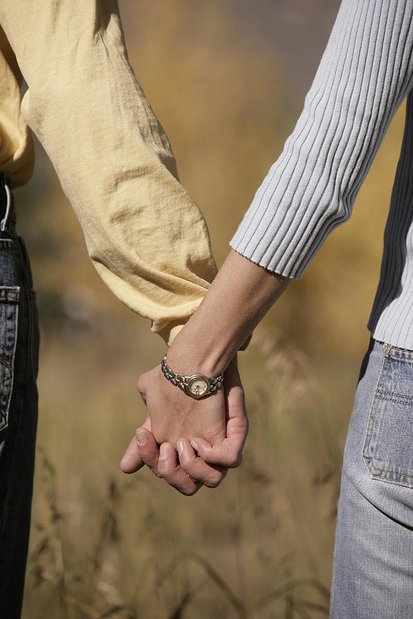 Couple holding hands Photograph by Comstock Images