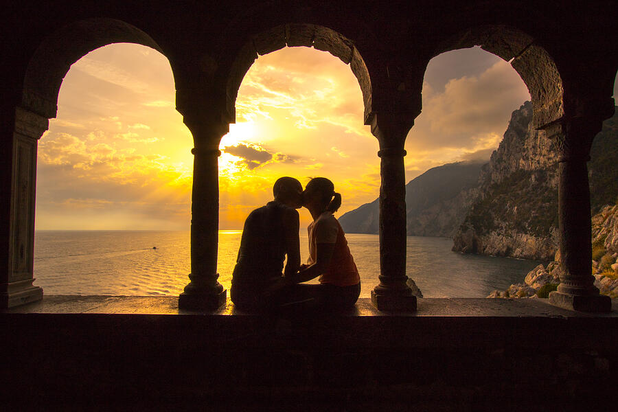 couple kissing at sunset of Portovenere, Liguria Photograph by Apostoli Rossella