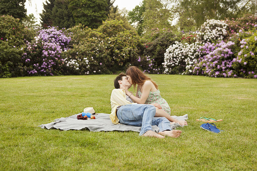 Couple Kissing, Having Picnic In Park. Photograph by Betsie Van Der Meer