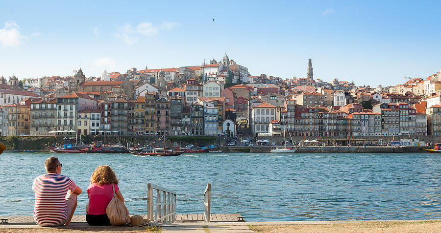 Couple looking at the historic center of Porto, Portugal Photograph by Maksim Ozerov