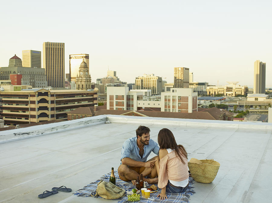 Couple on a rooftop Photograph by Carsten Goerling