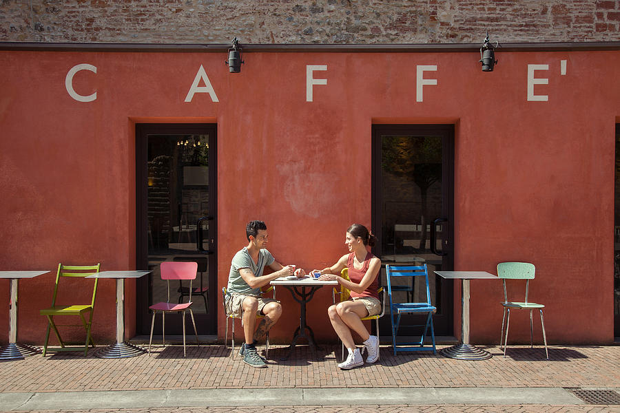 Couple sitting outside cafe, Florence, Tuscany, Italy Photograph by Innocenti