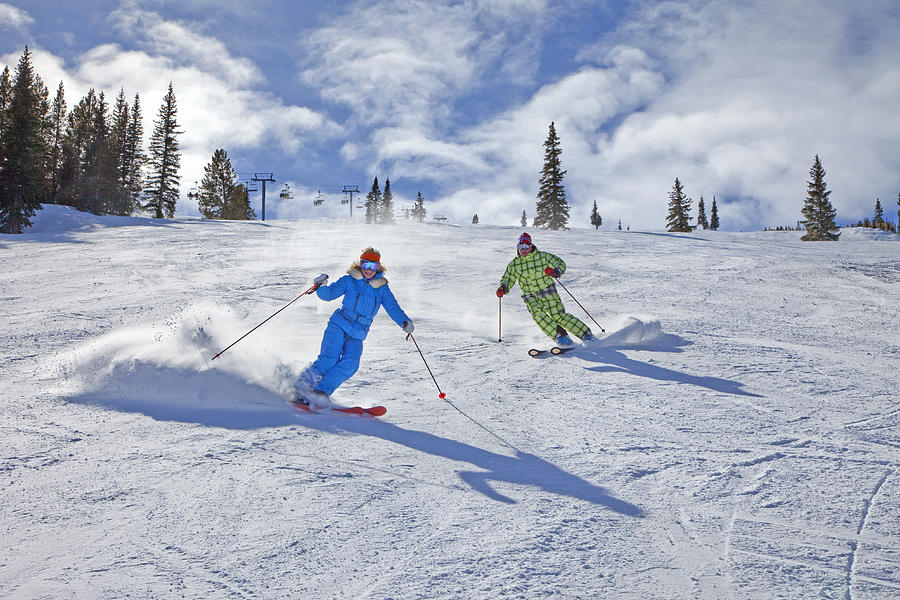Couple skiing Photograph by Karl Weatherly