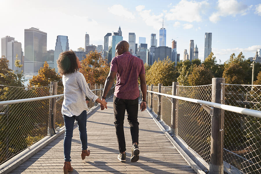 Couple Visiting New York With Manhattan Skyline In Background Photograph by Monkeybusinessimages