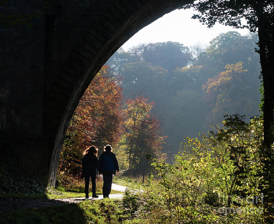 Couple walking Durham Photograph by Bryan Attewell