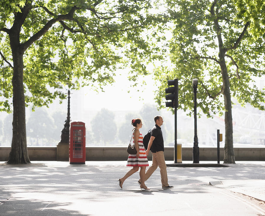 Couple walking together on urban street, London, United Kingdom Photograph by Jacobs Stock Photography Ltd