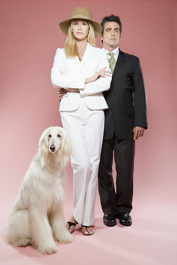 Couple with an afghan hound Photograph by Image Source