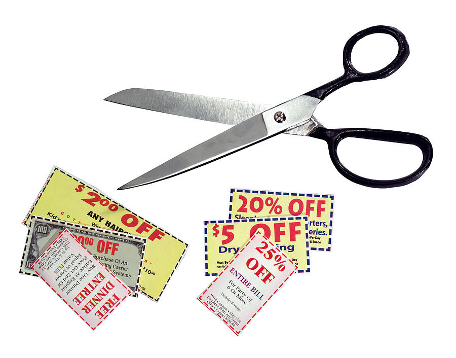 Coupons and scissors Photograph by Brand X Pictures