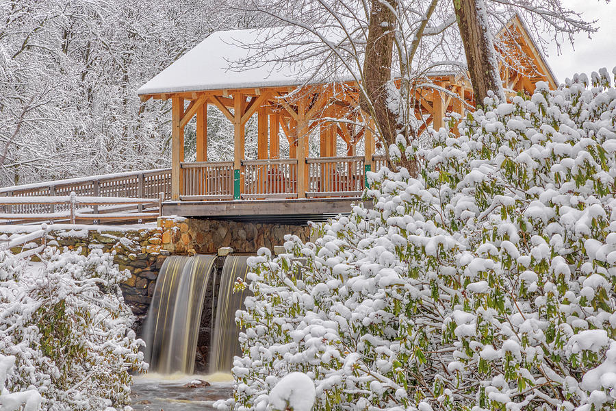 Covered Enchanta Bridge and waterfall Winter Wonderland Photograph by Juergen Roth