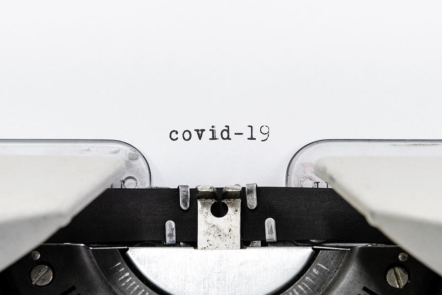 COVID-19 Text Typed on Typewriter Photograph by Nora Carol Photography