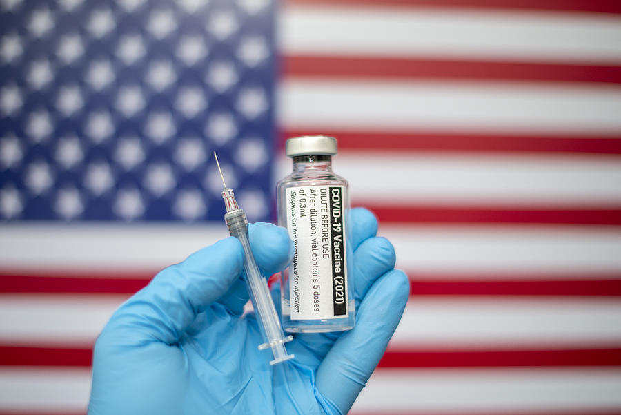 Covid-19 vaccine with syringe and American flag image in the background, Coronavirus SARS-CoV-2, vaccination Photograph by Paul Biris