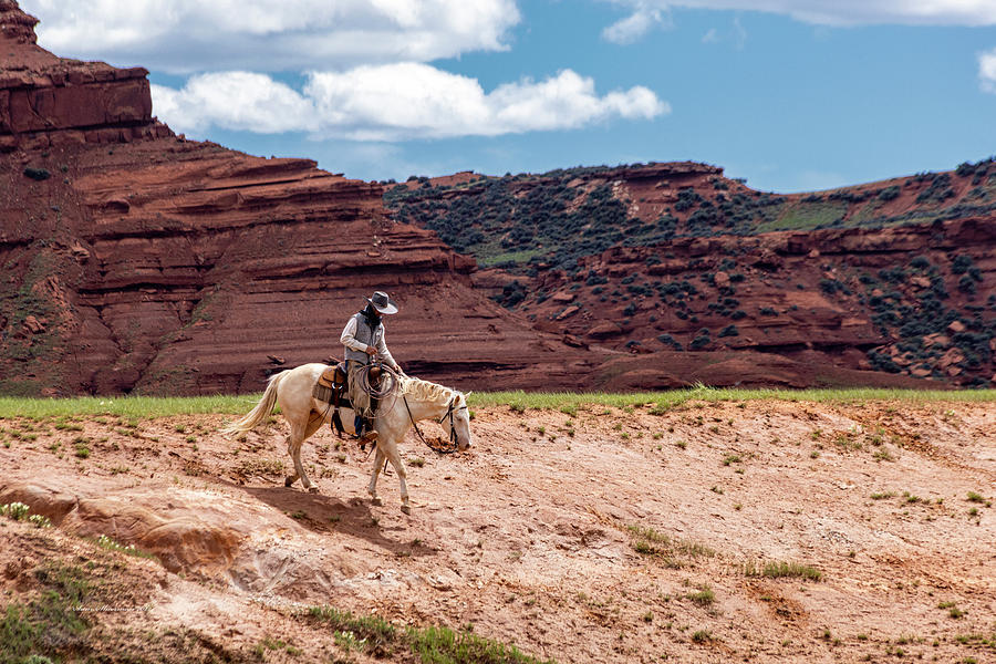 Cowboy Along Red Wall Photograph by Sam Sherman