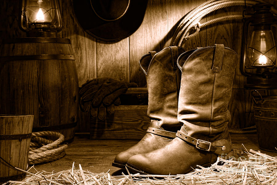 Cowboy Boots in a Ranch Barn - Sepia Photograph by Olivier Le Queinec