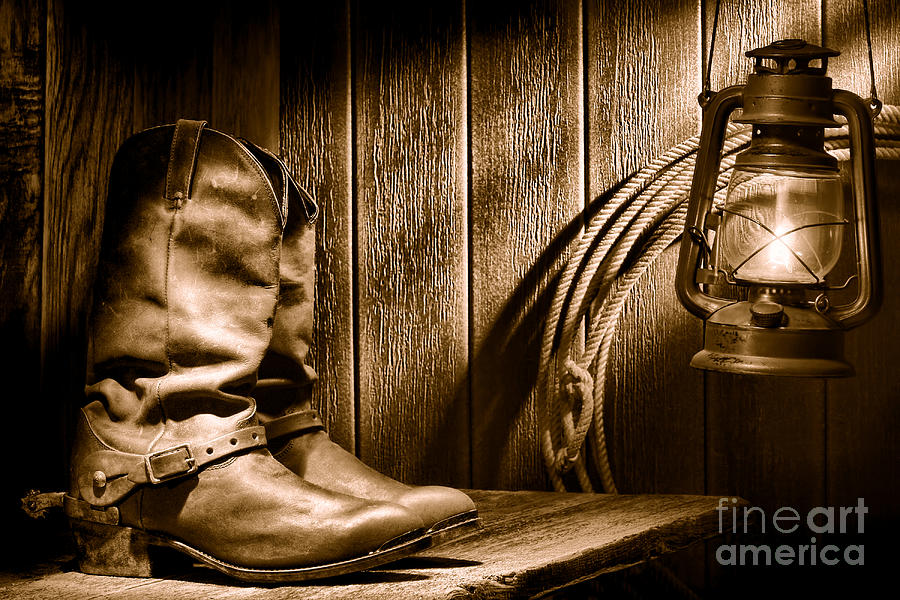 Cowboy Boots in Old Barn - Sepia Photograph by Olivier Le Queinec